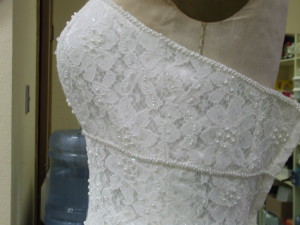 Here is the completed gown. I sewed the beads on by hand, copying the exact pattern of the beadwork.